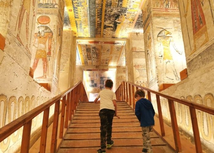 Two-boys-exiting-the-sarcophagus-of-Rameses-V-in-the-Valley-of-the-Kings